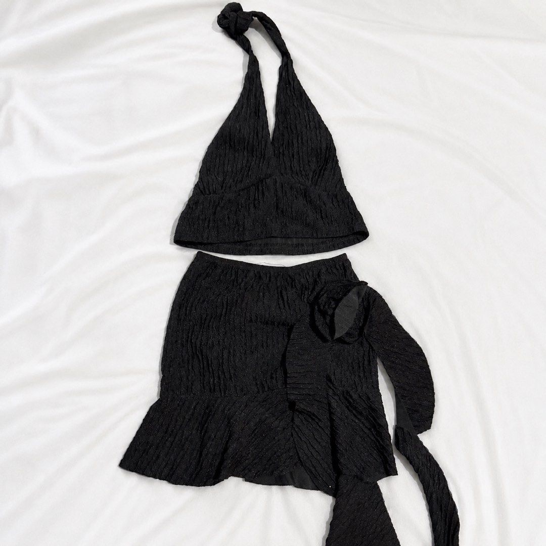 Black Textured Halter Top and Mini Skirt Set (Category: Sets or Coordinates) located in Manila. Submitted by kyla_tecson (Listing ID 1446848286, Image 1). Description: - Cute black textured set - Halter neck top with back ties - Mini skirt with ruffled hem and tie detail - Crinkled fabric with subtle sparkle - Ideal for night outs or vacations - Versatile styling with heels or sandals.