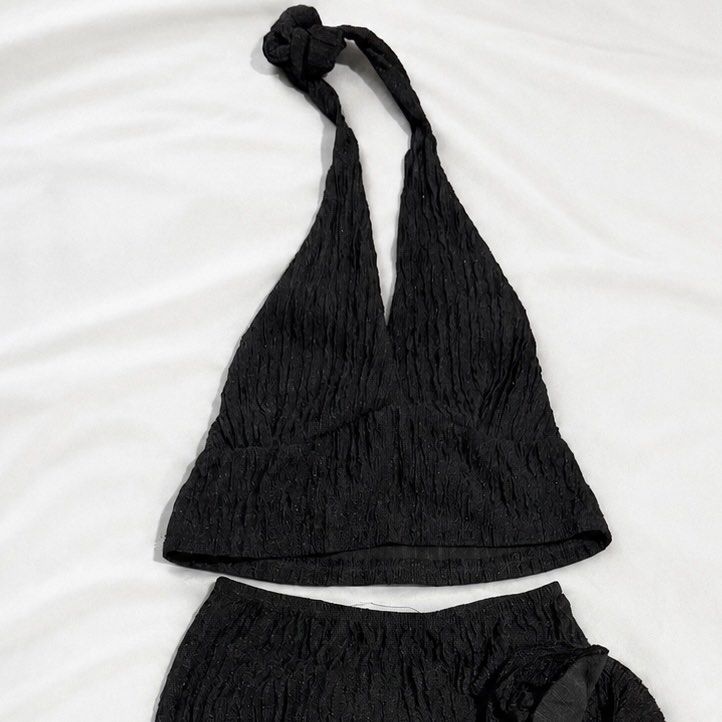 Black Textured Halter Top and Mini Skirt Set (Category: Sets or Coordinates) located in Manila. Submitted by kyla_tecson (Listing ID 1446848286, Image 3). Description: - Cute black textured set - Halter neck top with back ties - Mini skirt with ruffled hem and tie detail - Crinkled fabric with subtle sparkle - Ideal for night outs or vacations - Versatile styling with heels or sandals.