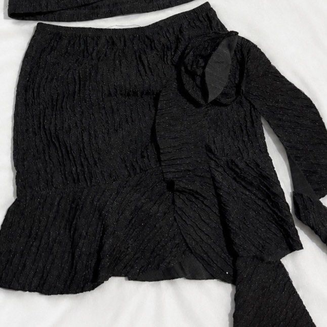 Black Textured Halter Top and Mini Skirt Set (Category: Sets or Coordinates) located in Manila. Submitted by kyla_tecson (Listing ID 1446848286, Image 2). Description: - Cute black textured set - Halter neck top with back ties - Mini skirt with ruffled hem and tie detail - Crinkled fabric with subtle sparkle - Ideal for night outs or vacations - Versatile styling with heels or sandals.