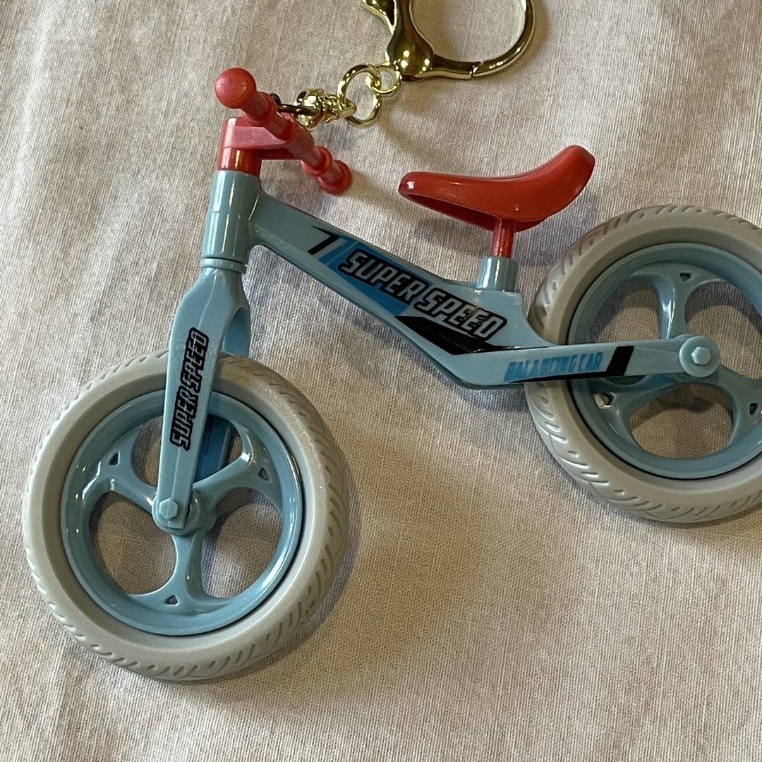 Brand New! Super Speed Balancing Bicycle Keychain (Category: Bicycles) located in Quezon City. Submitted by shelved (Listing ID 1446773785, Image 2). Description: - Adorable blue balance bike keychain. - Features 'Super Speed' and 'Balancing Car' text. - Red seat and handlebars for a pop of color. - Light grey and blue wheels. - Durable gold clasp for keys or bags..