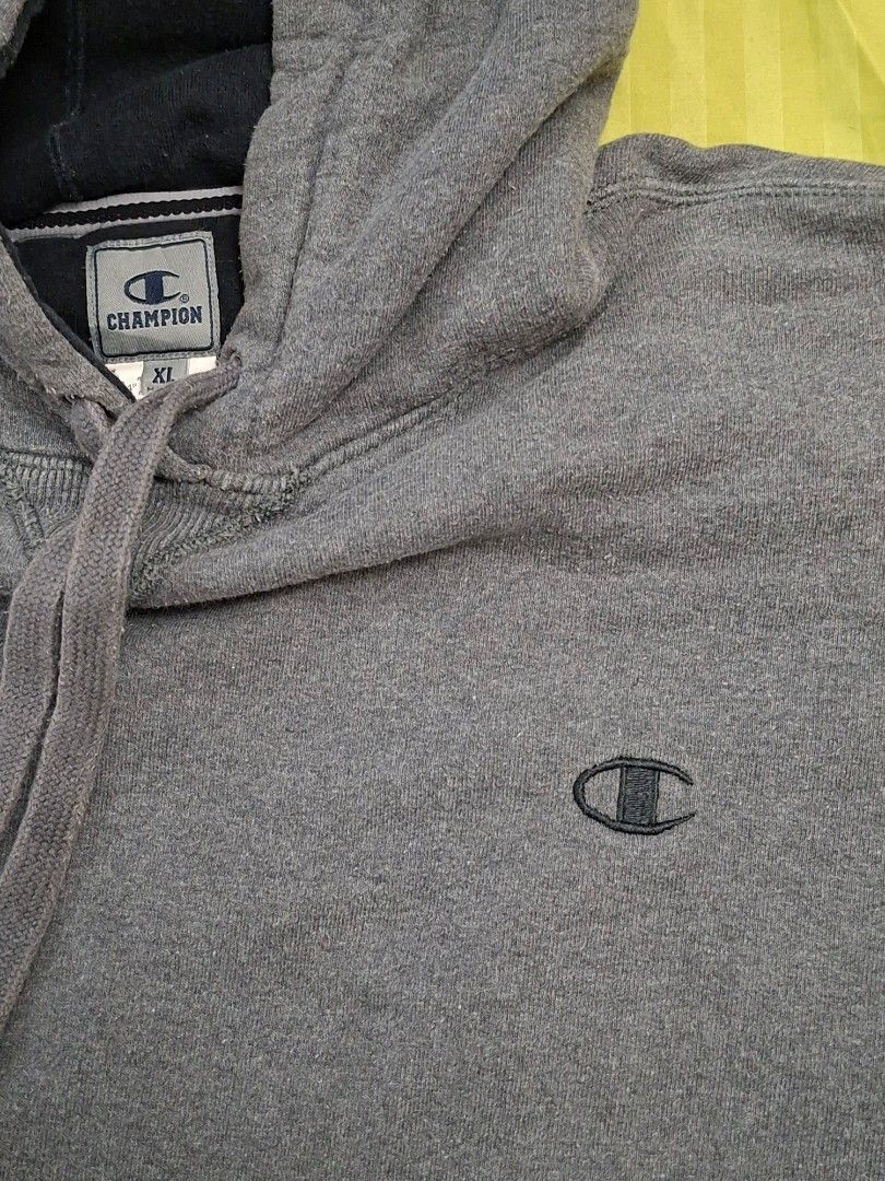 Champion Gray Pull Over Hoodie (Category: Coats, Jackets and Outerwear) located in Antipolo. Submitted by d.tuazon (Listing ID 1446844265, Image 3). Description: This is a Grey Champion Pull Over Hoodie featuring an embroidered logo on the chest.Makapal ang tela.Made in Mexico.Size 25 inches width and 27 inches length.ISSUE:Last picture,may konting tahi sa likod na gasgas at sa hood nya.Price is 450 only.Rizal area.Shipping sagot ng buyer..