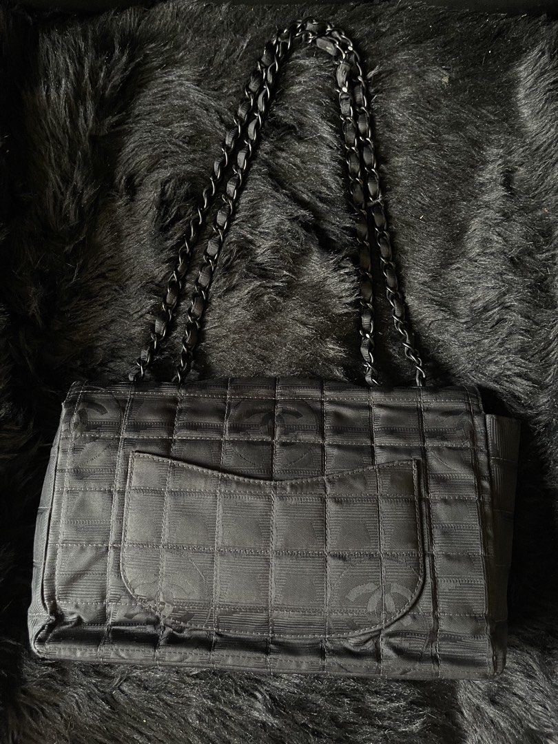 Chanel Travel Line Nylon Medium Flap Bag (Category: Luxury Bags & Wallets) located in Davao. Submitted by boodle4lyf (Listing ID 1446791899, Image 2). Description: Authentic or money back Chanel Travel Line Nylon Medium Flap Bag. Black nylon, chocolate bar quilting. Main signs of use sa hardwares due to usage but other than that, item is in good used condition. Clean satin interior and holo intact..