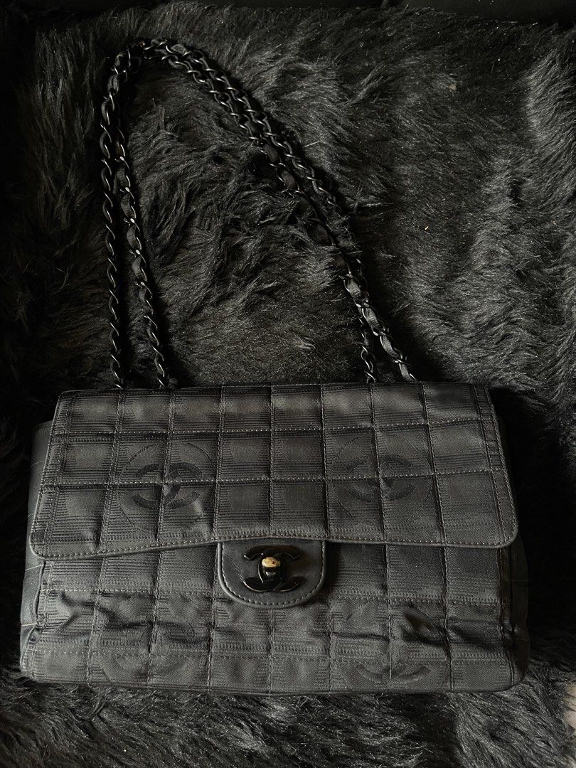 Chanel Travel Line Nylon Medium Flap Bag (Category: Luxury Bags & Wallets) located in Davao. Submitted by boodle4lyf (Listing ID 1446791899, Image 1). Description: Authentic or money back Chanel Travel Line Nylon Medium Flap Bag. Black nylon, chocolate bar quilting. Main signs of use sa hardwares due to usage but other than that, item is in good used condition. Clean satin interior and holo intact..