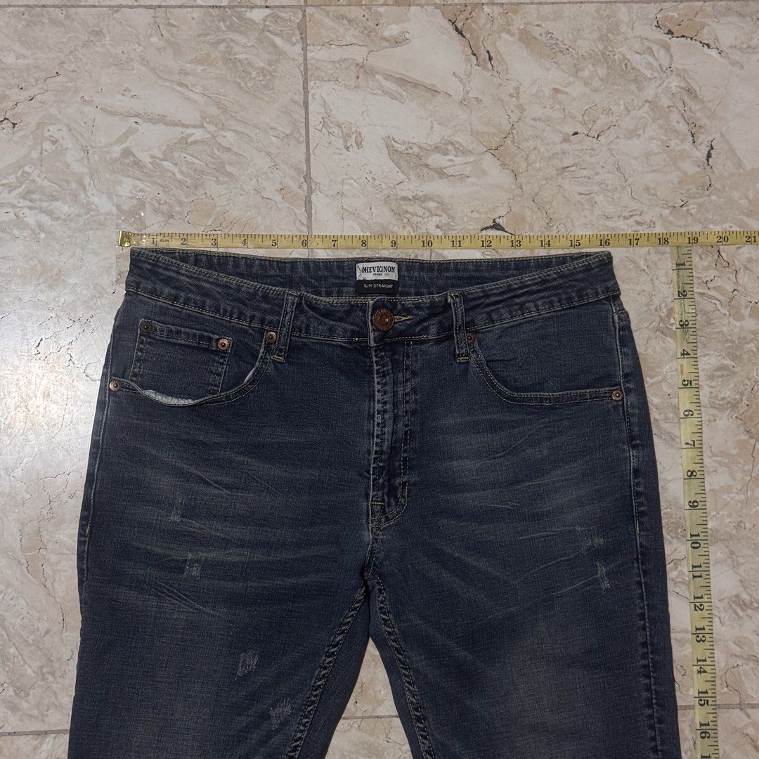 Chevignon Slim Straight Blue Denim Jeans (Category: Jeans) located in Quezon City. Submitted by EveryWANTShop (Listing ID 1446879350, Image 2). Description: - Classic blue denim jeans from Chevignon - Slim straight fit - Distressed details and fading throughout - Button fly closure - Ideal for everyday wear - Measurements available in photos.