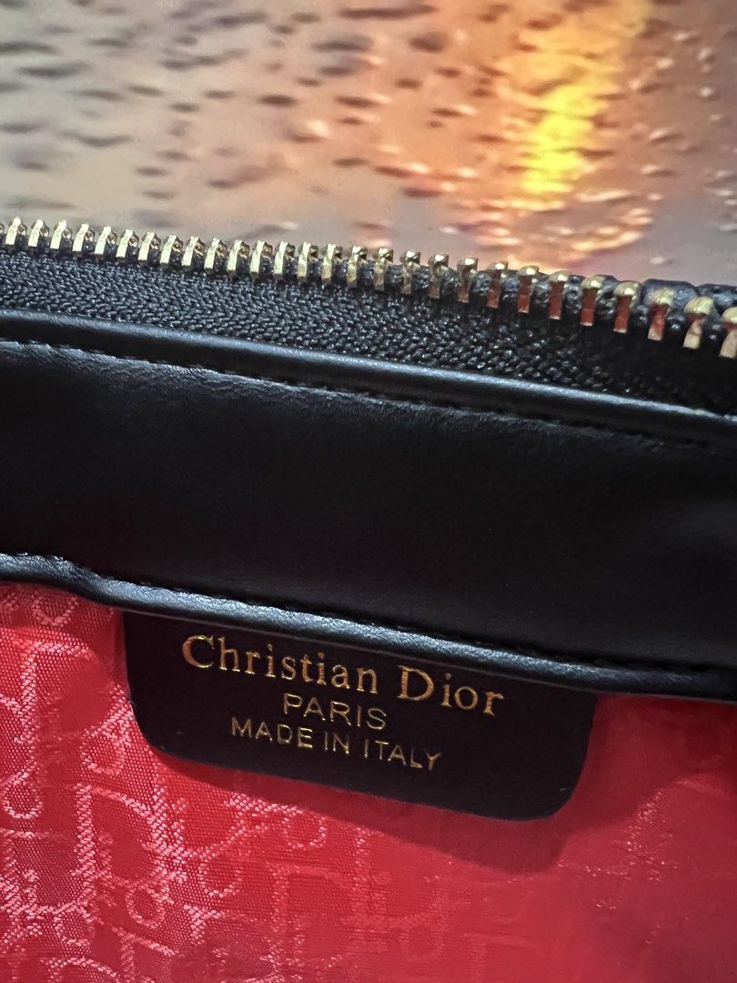 Christian Dior Black Monogram Tote Bag with Pouch (Category: Luxury Bags & Wallets) located in Quezon City. Submitted by sofia_1225 (Listing ID 1446760955, Image 3). Description: Comes with dustbag only - All-over Dior Monogram Pattern - Comes with a matching Black Dior Pouch - Red Fabric Interior Lining with Dior Monogram Print - Gold-tone Zippers and Hardware - Ideal for Everyday Use or Travel.