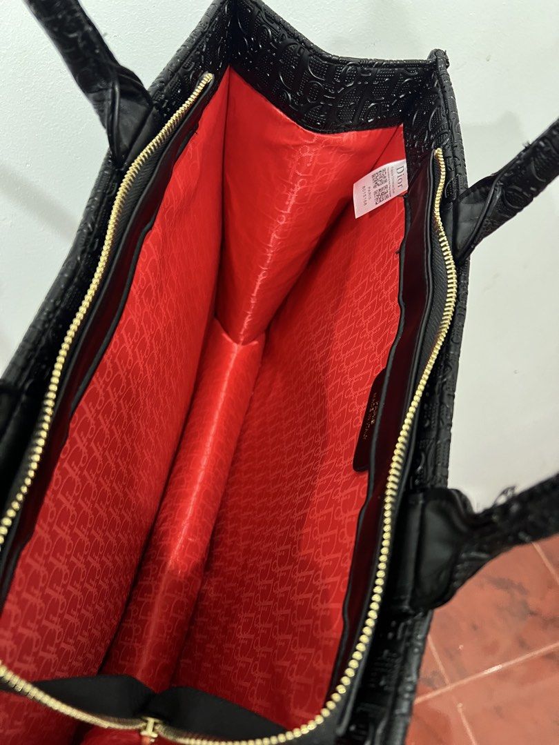 Christian Dior Black Monogram Tote Bag with Pouch (Category: Luxury Bags & Wallets) located in Quezon City. Submitted by sofia_1225 (Listing ID 1446760955, Image 2). Description: Comes with dustbag only - All-over Dior Monogram Pattern - Comes with a matching Black Dior Pouch - Red Fabric Interior Lining with Dior Monogram Print - Gold-tone Zippers and Hardware - Ideal for Everyday Use or Travel.