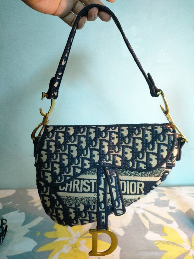 Christian Dior Saddle Bag Oblique Canvas (Category: Luxury Bags & Wallets) located in Mandaluyong City. Submitted by Love.Boutique (Listing ID 1446856812, Image 3). Description: - Iconic Dior Saddle Bag - Signature Oblique canvas - Elegant gold hardware - Detachable strap for versatile wear (shoulder/crossbody) - Chic and highly versatile for daily or special events.