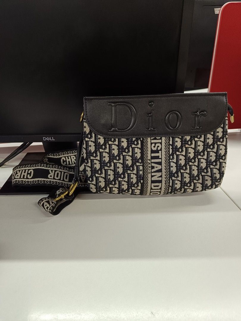 Christian Dior sling bag (Category: Luxury Bags & Wallets) located in Cebu City. Submitted by negotiableprice22 (Listing ID 1446867681, Image 1). Description: CHRISTIAN DIOR Sling bag made in Italy super ganda po, nakaw pansin talaga gamitin sa occasions or sa work BIG FONT SPELL DIOR sa harap at monogram din sya / rare na design as I observe sa carousell sa sling naman nya ay naka spell out ang branding nya pwede cross body bag pwede sling bag a