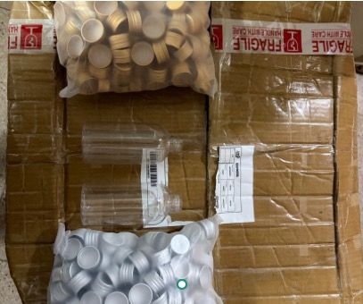Clear Plastic Bottles with Gold and Silver Caps496762631435724800