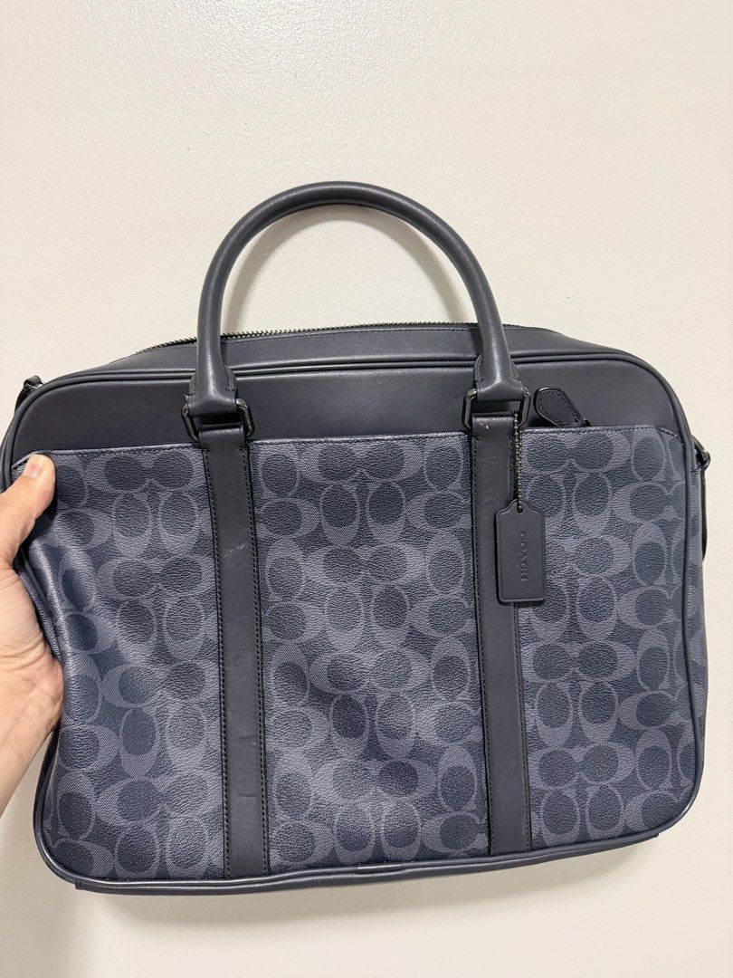 Coach Signature Monogram Leather Briefcase (Category: Briefcases) located in Pasig City. Submitted by xublime.cloud (Listing ID 1446747604, Image 2). Description: Very minimal signs of use RFS: bought a new bag - Classic Coach briefcase - Signature monogram pattern - Leather trim and handles - Zipper closure - Multiple interior compartments for organization - Ideal for work or travel - Includes Coach hang tag.