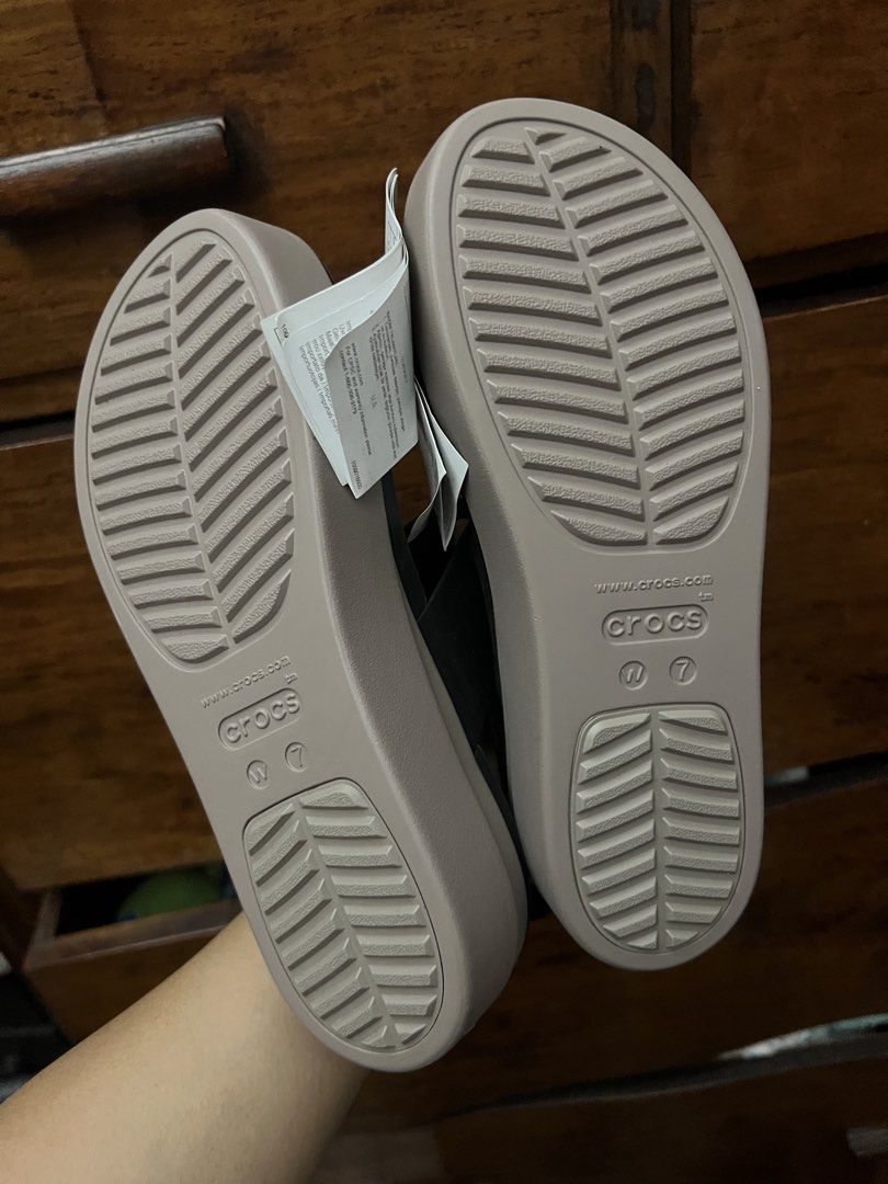 Crocs Brooklyn Low Wedge Sandals Black Tan Size 7 (Category: Flats & Sandals) located in Manila. Submitted by checkoutville (Listing ID 1446749745, Image 3). Description: - Brand new Black and Tan Crocs Brooklyn Low Wedge sandals - Women's Size 7 - Adjustable ankle strap for a secure fit - Comfortable platform sole for all-day wear - Ideal for casual outings - Original tags still attached.