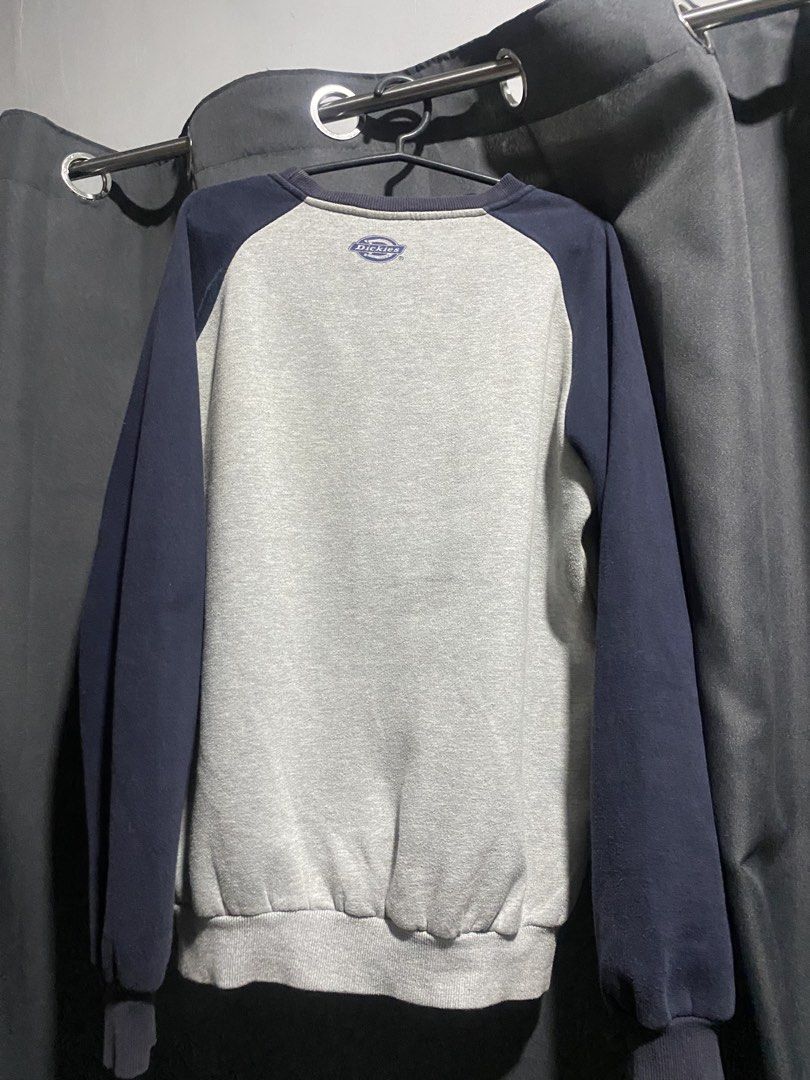 Dickies 1922 American Original Raglan Sweatshirt (Category: Coats, Jackets and Outerwear) located in Manila. Submitted by sellorbi (Listing ID 1446821987, Image 2). Description: - Dickies raglan sweatshirt in grey and navy. - Features 'Original Brand 1922 Dickies American Original' graphic on the front. - Classic crewneck design. - Ribbed cuffs and hem for a comfortable fit. - Ideal for everyday casual wear. - Easily pairs with jeans or shorts..