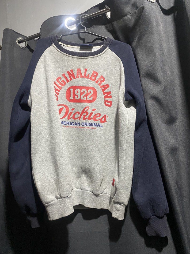 Dickies 1922 American Original Raglan Sweatshirt (Category: Coats, Jackets and Outerwear) located in Manila. Submitted by sellorbi (Listing ID 1446821987, Image 1). Description: - Dickies raglan sweatshirt in grey and navy. - Features 'Original Brand 1922 Dickies American Original' graphic on the front. - Classic crewneck design. - Ribbed cuffs and hem for a comfortable fit. - Ideal for everyday casual wear. - Easily pairs with jeans or shorts..