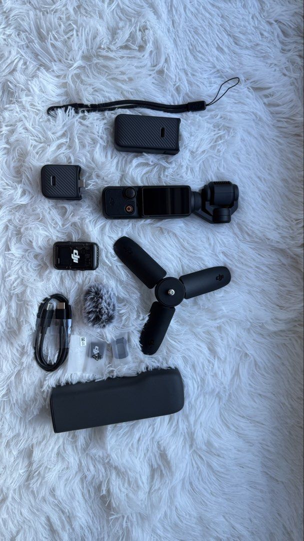 DJI Osmo Pocket 3 Creator Combo with Accessories (Category: Cameras) located in Makati City. Submitted by severusss (Listing ID 1446865359, Image 1). Description: - DJI Osmo Pocket 3 Creator Combo - Includes camera, tripod, wireless microphone, charging cable, and other accessories except wide angle lens - Ideal for vlogging and capturing incredibly smooth footage. - All items are in good working condition. - 90% smooth, got some little scratches