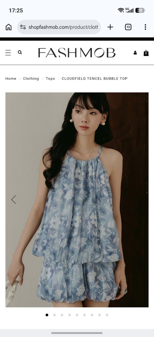 BNWT [FASHMOB]Cloudfield Tencel Bubble Top (Category: Blouses) located in Kuala Lumpur. Submitted by suziestash (Listing ID 1446816439, Image 2). Description: - Cute blue floral top from FASHMOB - Made from light and airy Tencel material - Features a stylish bubble hem design - Halter neck with adjustable straps for a perfect fit - Ideal for casual wear or beach outings - Pairs well with shorts or skirts.