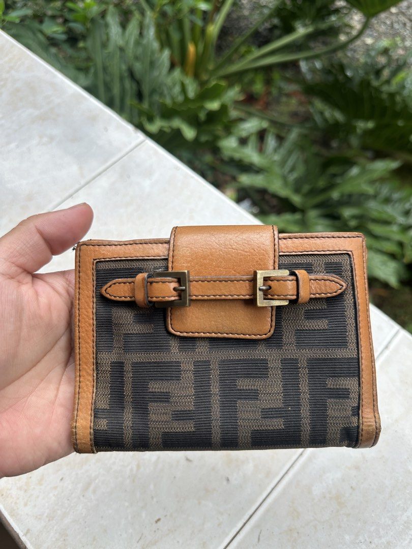 Fendi Zucca Canvas Leather Bifold Wallet (Category: Luxury Bags & Wallets) located in Bustos. Submitted by theprelovedshopbulacan (Listing ID 1446738824, Image 1). Description: - Authentic Fendi wallet - Classic Zucca canvas with tan leather trim - Bifold design - Multiple card slots - Coin pocket - Serial number visible inside.