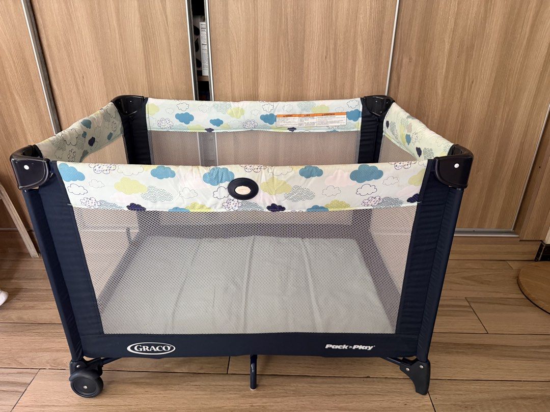 Graco Pack 'n Play Playard (Category: Cots & Cribs) located in Pasig City. Submitted by miso1219 (Listing ID 1446904072, Image 2). Description: - Graco Pack 'n Play playard - Navy blue with cute cloud pattern accent - Mesh sides for excellent ventilation - Includes a comfortable padded mattress - Equipped with wheels for easy transport - Ideal for baby's naps and playtime.