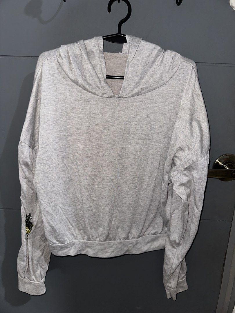 Grey Hoodie w/ Flowers (Category: Coats, Jackets and Outerwear) located in Rizal. Submitted by ryannesua47021 (Listing ID 1446858866, Image 1). Description: - Light grey hoodie - Embroidered floral and butterfly details on sleeves - Long sleeves with elasticated cuffs - Hooded neckline - Casual and comfortable for everyday wear - Easy to style with jeans or leggings.