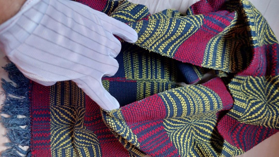 Handwoven Scarf with Geometric Pattern and Fringe (Category: Scarves) located in Paranaque City. Submitted by daddyu (Listing ID 1446823396, Image 3). Description: - Handwoven scarf with striking geometric pattern. - Features bold stripes in maroon, navy, and yellow. - Finished with fringe detail at the ends. - Approximate measurements: [insert length] by [insert width]. - Perfect for adding a pop of color to any outfit. - A unique textile art pi