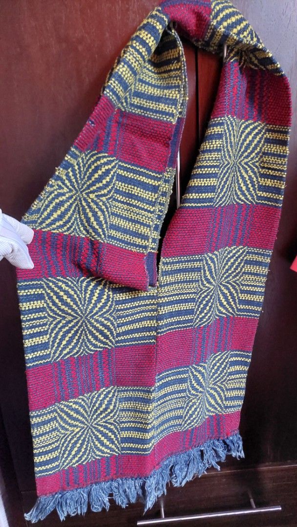 Handwoven Scarf with Geometric Pattern and Fringe (Category: Scarves) located in Paranaque City. Submitted by daddyu (Listing ID 1446823396, Image 1). Description: - Handwoven scarf with striking geometric pattern. - Features bold stripes in maroon, navy, and yellow. - Finished with fringe detail at the ends. - Approximate measurements: [insert length] by [insert width]. - Perfect for adding a pop of color to any outfit. - A unique textile art pi