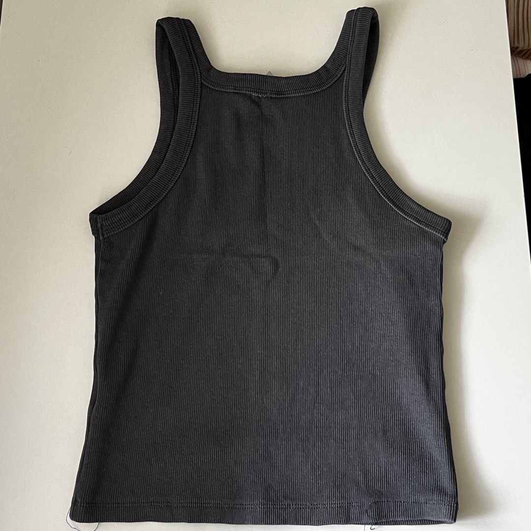 H&M Ribbed Tank Top - Charcoal Grey (Category: Sleeveless) located in Manila. Submitted by may077. (Listing ID 1446792574, Image 3). Description: - Basic ribbed tank top from H&M - Color: Charcoal Grey - Features: High neckline, racerback style - Material: Stretchy and comfortable - Versatile: Great for layering or wearing on its own - Style: Easy to match with any outfit.