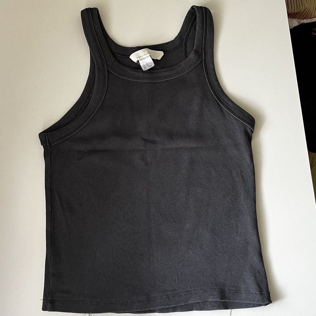 H&M Ribbed Tank Top - Charcoal Grey (Category: Sleeveless) located in Manila. Submitted by may077. (Listing ID 1446792574, Image 1). Description: - Basic ribbed tank top from H&M - Color: Charcoal Grey - Features: High neckline, racerback style - Material: Stretchy and comfortable - Versatile: Great for layering or wearing on its own - Style: Easy to match with any outfit.