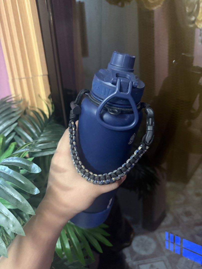Aqua Flask Water Bottle with Paracord Handle blue (Category: Water Bottles & Tumblers) located in Malabon City. Submitted by djvitv (Listing ID 1446826924, Image 3). Description: Used once only - Navy blue Hydro Flask water bottle - Includes blue and camouflage paracord handle for easy carrying - Features a blue rubber boot at the base for protection - Ideal for staying hydrated anywhere - Durable and stylish design Rfs. Extra .