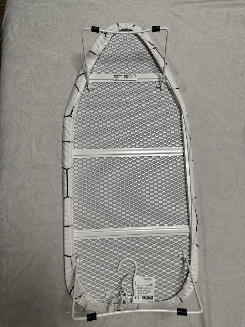 IKEA Tabletop Ironing Board 73x32cm (Category: Home Improvement Tools & Accessories) located in Cavite. Submitted by jazz.shop (Listing ID 1446784266, Image 2). Description: - Dimensions: 73x32 cm - Features a stylish geometric pattern - Elasticated edges and drawstring for a snug, secure fit - Easy to put on and remove.