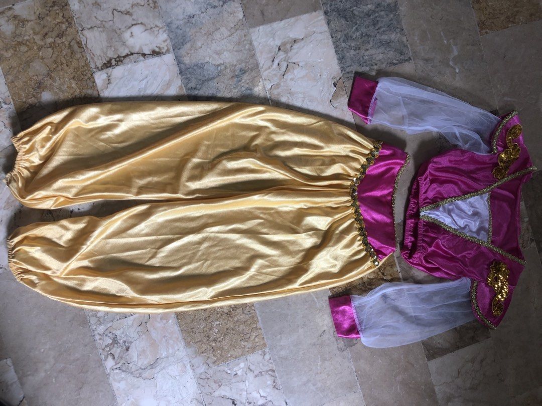 Kids Jasmine Princess Costume (Category: Babies & Kids Fashion) located in San Pedro. Submitted by tipbox (Listing ID 1446903567, Image 1). Description: - Adorable princess costume set - Includes pink top with gold trim and sheer sleeves - White inset and gold shoulder embellishments on top - Comfortable gold harem pants with elastic waist and cuffs - Perfect for dress-up, parties, or any little fan!.