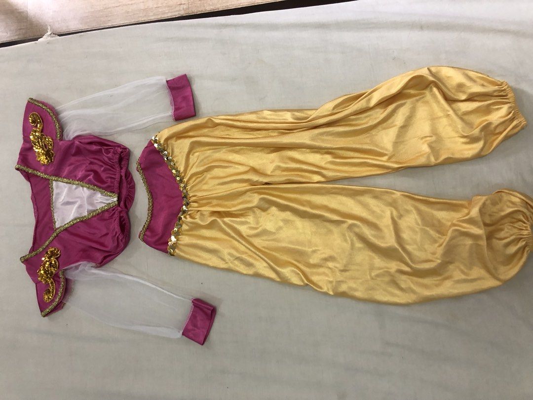 Kids Jasmine Princess Costume (Category: Babies & Kids Fashion) located in San Pedro. Submitted by tipbox (Listing ID 1446903567, Image 2). Description: - Adorable princess costume set - Includes pink top with gold trim and sheer sleeves - White inset and gold shoulder embellishments on top - Comfortable gold harem pants with elastic waist and cuffs - Perfect for dress-up, parties, or any little fan!.