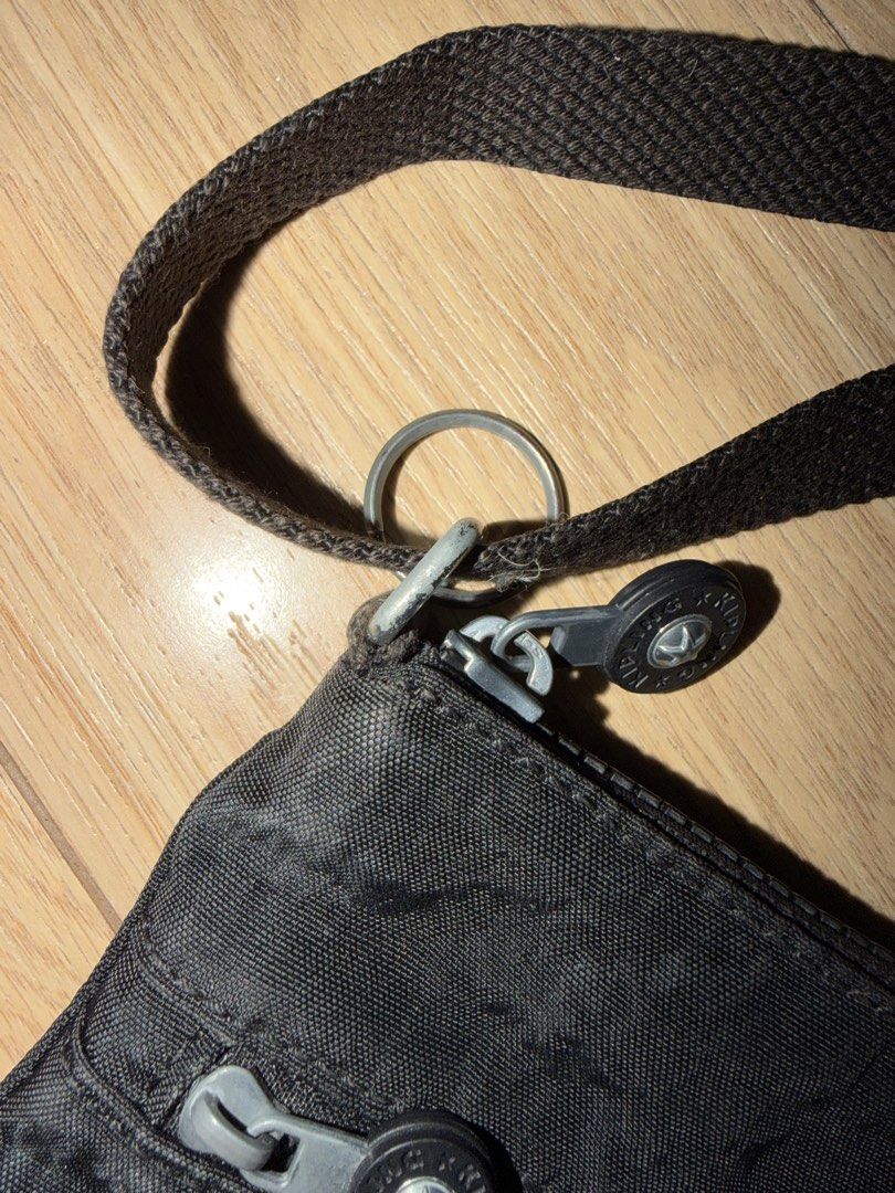 Kipling Black Nylon Crossbody Bag (Category: Cross-body Bags) located in Mandaluyong City. Submitted by declutteringcorner (Listing ID 1446723271, Image 2). Description: - Brand: Kipling - Color: Black - Material: Nylon - Pockets: Two zippered front pockets, one main zippered compartment - Strap: Adjustable - Features: Compact, lightweight - Ideal for: Everyday use, travel - Tarnish on the hardwares Rfs: decluttering.