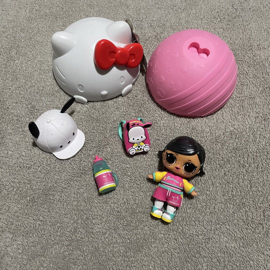LOL Surprise Doll with Hello Kitty Container and Accessories (Category: Kids Toys) located in Las Pinas. Submitted by chocolemon (Listing ID 1446872573, Image 1). Description: - LOL Surprise doll - Includes Kitty container - Comes with accessories: small backpack, bottle, white cap - Doll is wearing a soccer-themed outfit - Ideal for collectors or playtime fun.