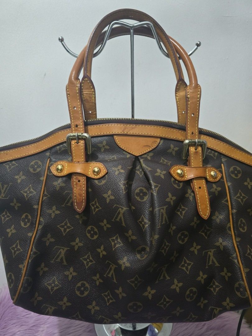 Louis Vuitton Monogram Canvas Tote Bag (Category: Luxury Bags & Wallets) located in Pasig City. Submitted by zealfish.3d4f32 (Listing ID 1446725323, Image 2). Description: - Classic Louis Vuitton monogram canvas tote - Brown leather trim and handles - Spacious interior with multiple pockets - Secure zipper closure - Timeless everyday bag - Note: Shows some signs of wear on leather trim and handles.