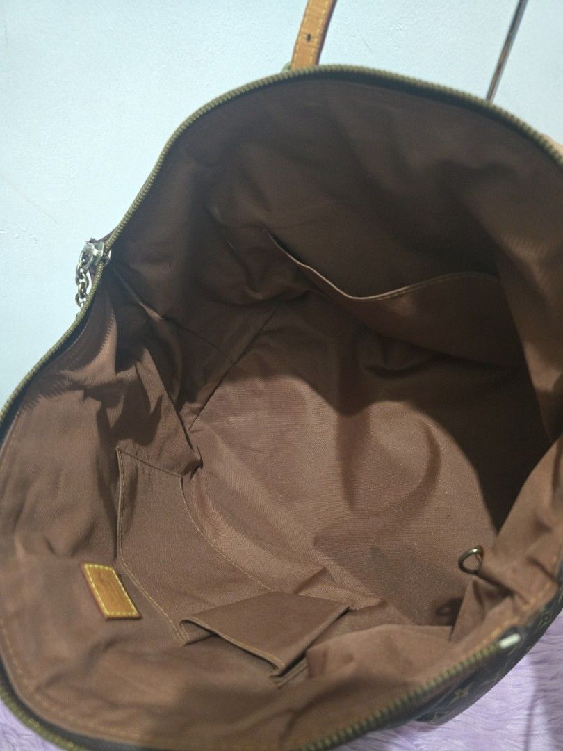 Louis Vuitton Monogram Canvas Tote Bag (Category: Luxury Bags & Wallets) located in Pasig City. Submitted by zealfish.3d4f32 (Listing ID 1446725323, Image 3). Description: - Classic Louis Vuitton monogram canvas tote - Brown leather trim and handles - Spacious interior with multiple pockets - Secure zipper closure - Timeless everyday bag - Note: Shows some signs of wear on leather trim and handles.