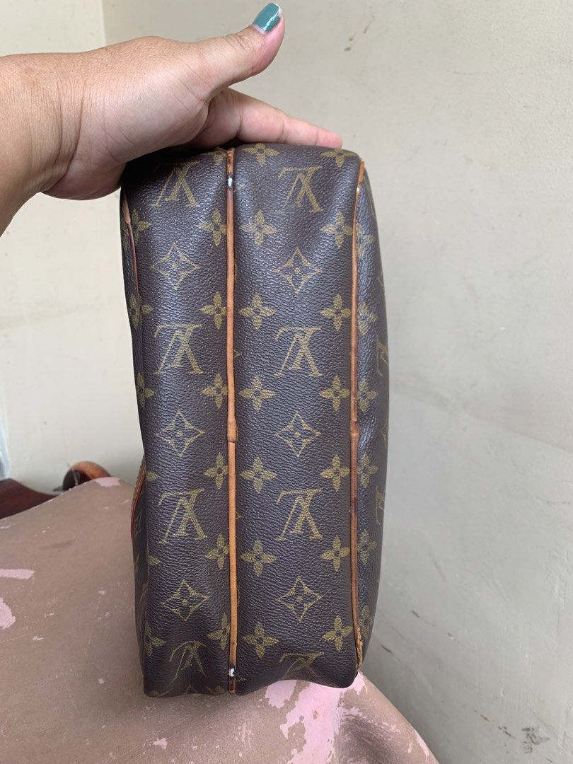 Louis Vuitton Monogram Canvas Crossbody Bag (Category: Luxury Bags & Wallets) located in Liloan. Submitted by jinalyns (Listing ID 1446736987, Image 3). Description: - Classic Louis Vuitton monogram canvas crossbody bag - Signature brown LV pattern - Leather trim and adjustable canvas strap - Main zippered compartment with interior pockets - Ideal for everyday use - Shows some signs of wear on leather trim and strap.