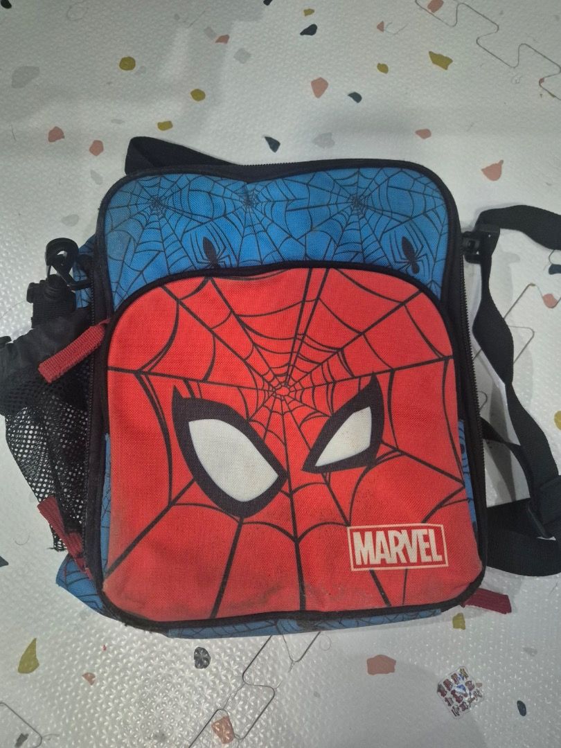 Marvel Spiderman Insulated Lunch Bag (Category: Other Babies Going Out Needs) located in Quezon City. Submitted by shopus2mnl (Listing ID 1446808526, Image 1). Description: - Awesome Spiderman design for kids! - Vibrant red exterior with Spiderman mask. - Fun blue interior featuring a web print. - Insulated lining keeps food fresh and cool. - Secure zipper closure for easy access. - Ideal for school lunches or fun outings..