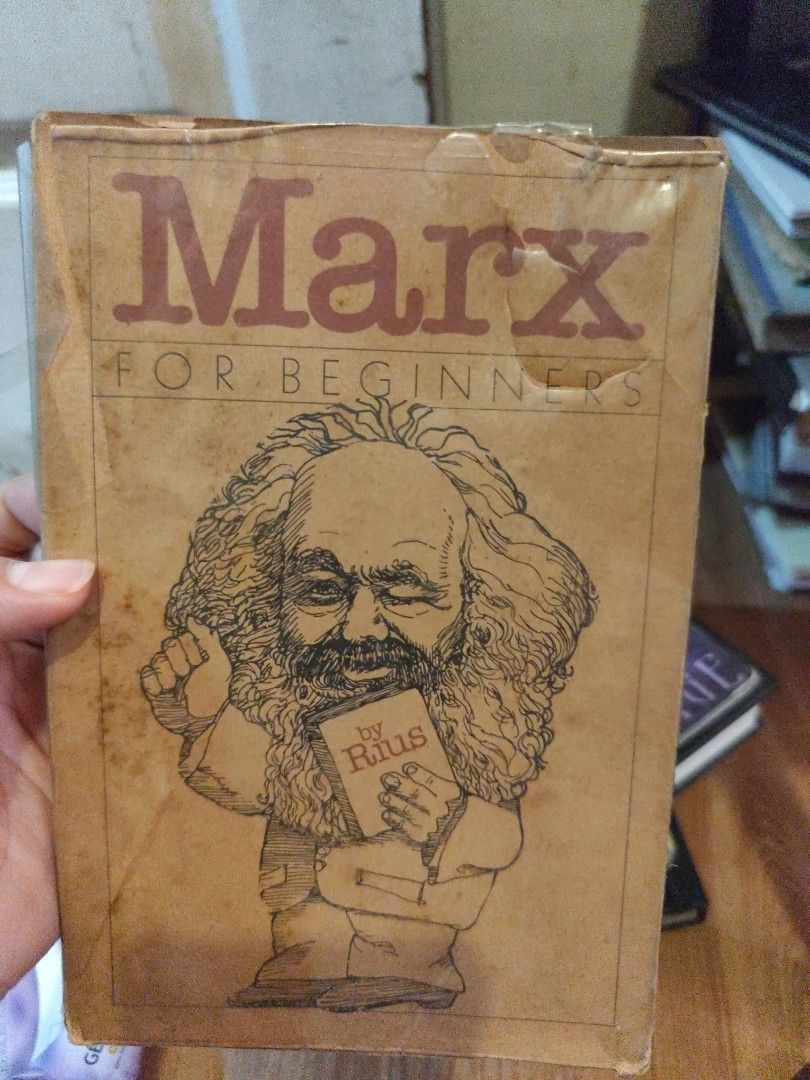 Marx for Beginners by Rius Illustrated Book (Category: Storybooks) located in Manila. Submitted by silentstar-0f4b (Listing ID 1446761933, Image 1). Description: - 'Marx for Beginners' by Rius - Illustrated guide to Karl Marx's key ideas - Pages show natural yellowing due to age - Cover has some signs of wear - Perfect for beginners interested in Marxist philosophy - Sold as is.