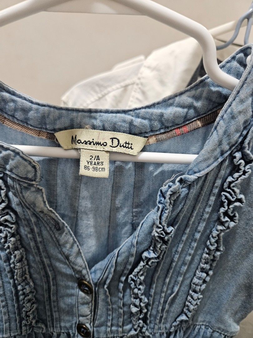 Massimo Dutti Blue Denim Ruffle Dress (Category: Dresses) located in Manila. Submitted by online.tipid (Listing ID 1446847688, Image 2). Description: - Cute blue denim dress - Brand: Massimo Dutti - Features ruffles down the front and on the hem - Short sleeves - Button-up front - Ideal for casual wear rfs: outgrown 📍 Cavite.