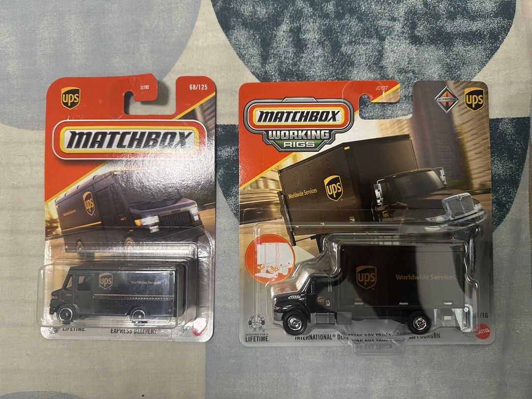 Matchbox Working Rigs UPS Trucks (2 pcs) (Category: Vehicle & Diecast Models) located in Paranaque City. Submitted by motkigoodboy (Listing ID 1446830392, Image 2). Description: - Two Matchbox UPS trucks included: Express Delivery van and International Durastar Box Truck. - Both trucks are brand new and sealed in their original packaging. - Ideal for Matchbox collectors or young truck enthusiasts. - Great gift idea for kids who love delivery vehi