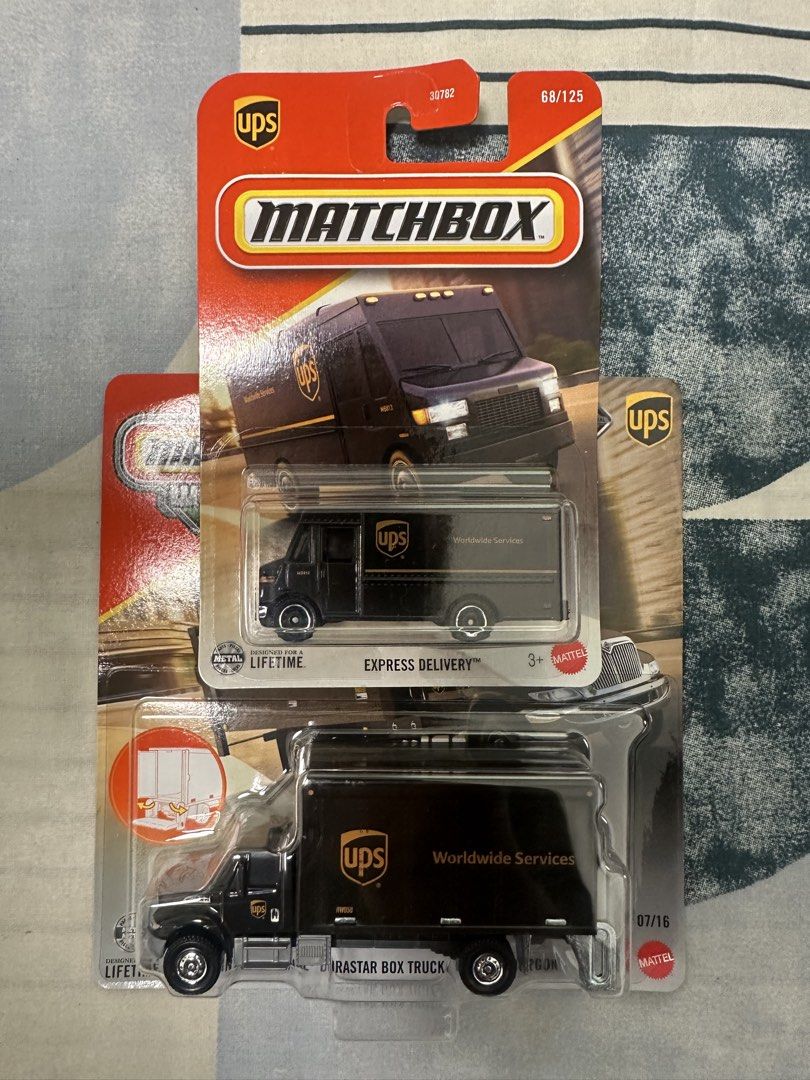Matchbox Working Rigs UPS Trucks (2 pcs) (Category: Vehicle & Diecast Models) located in Paranaque City. Submitted by motkigoodboy (Listing ID 1446830392, Image 1). Description: - Two Matchbox UPS trucks included: Express Delivery van and International Durastar Box Truck. - Both trucks are brand new and sealed in their original packaging. - Ideal for Matchbox collectors or young truck enthusiasts. - Great gift idea for kids who love delivery vehi