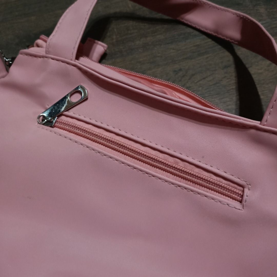 Michaela Hand/Sling Bag in Pastel Pink (Category: Luxury Bags & Wallets) located in San Pedro. Submitted by noriyarou (Listing ID 1446903441, Image 2). Description: Used. In good condition. All zippers are fully functional. Please note there is minor fraying of threads inside the bag, as pictured. Approximate measurements: Height: 9.5" Width (Length): 11" Depth (Gusset): 4.5" Strap length: 24.5" (max) Hand strap length: 6" Features: Authentic Mic