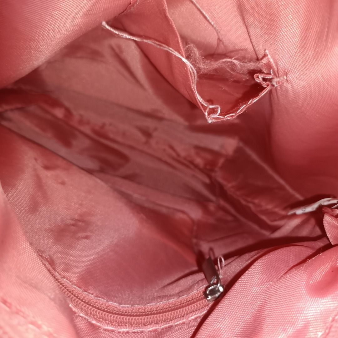 Michaela Hand/Sling Bag in Pastel Pink (Category: Luxury Bags & Wallets) located in San Pedro. Submitted by noriyarou (Listing ID 1446903441, Image 3). Description: Used. In good condition. All zippers are fully functional. Please note there is minor fraying of threads inside the bag, as pictured. Approximate measurements: Height: 9.5" Width (Length): 11" Depth (Gusset): 4.5" Strap length: 24.5" (max) Hand strap length: 6" Features: Authentic Mic