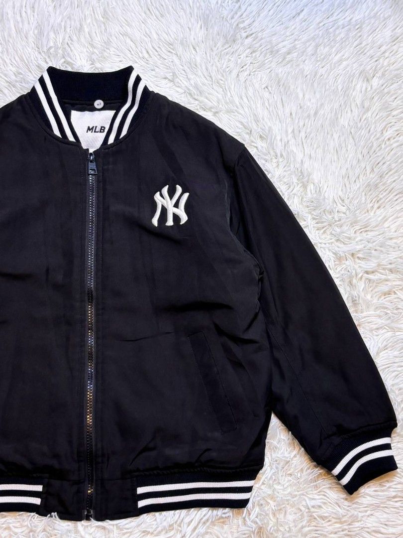 MLB New York Yankees Bomber Jacket Black White (Category: Babies & Kids Fashion) located in Catbalogan. Submitted by kristinapi (Listing ID 1446816181, Image 3). Description: - Classic black bomber jacket - Iconic NY Yankees logo on the back - White striped cuffs and collar - MLB branding on chest and inside label - Quilted lining for added warmth - Ideal for any New York Yankees fan.