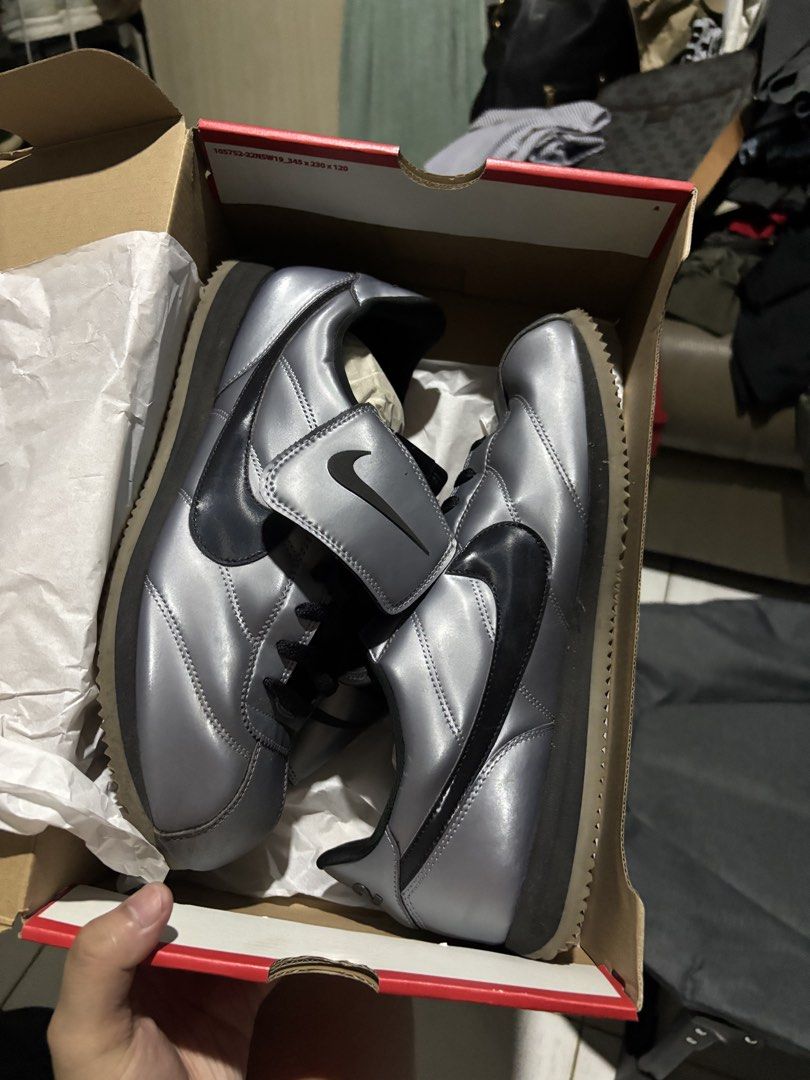 Nike Cortez Metallic Silver Black Swoosh (Category: Sneakers) located in Cebu City. Submitted by somewhereintime_ (Listing ID 1446743858, Image 1). Description: - Nike Cortez sneakers - Color: Metallic silver with black accents - Classic silhouette - Soles show some wear but retain good grip - Includes original box - Grab these iconic kicks!.