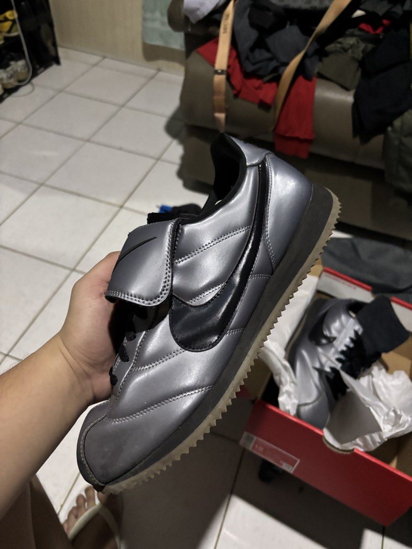 Nike Cortez Metallic Silver Black Swoosh (Category: Sneakers) located in Cebu City. Submitted by somewhereintime_ (Listing ID 1446743858, Image 2). Description: - Nike Cortez sneakers - Color: Metallic silver with black accents - Classic silhouette - Soles show some wear but retain good grip - Includes original box - Grab these iconic kicks!.