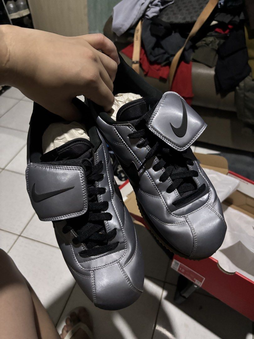 Nike Cortez Metallic Silver Black Swoosh (Category: Sneakers) located in Cebu City. Submitted by somewhereintime_ (Listing ID 1446743858, Image 3). Description: - Nike Cortez sneakers - Color: Metallic silver with black accents - Classic silhouette - Soles show some wear but retain good grip - Includes original box - Grab these iconic kicks!.
