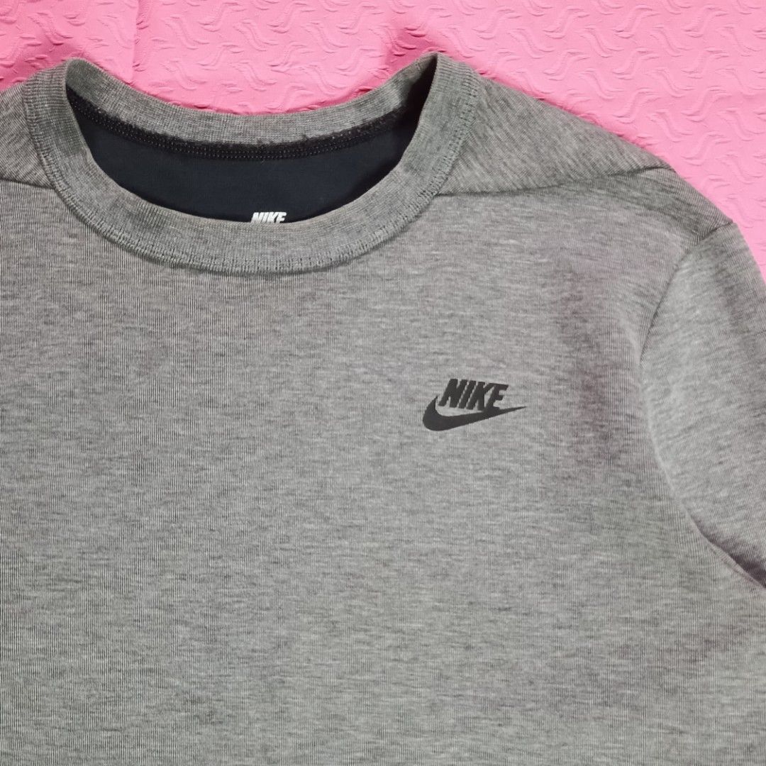 Nike Grey Crewneck Sweatshirt (Category: Coats, Jackets and Outerwear) located in Cavite. Submitted by ivanpluma (Listing ID 1446773470, Image 2). Description: - Grey Nike crewneck sweatshirt - Small black Nike logo on chest - Ribbed cuffs and hem - Comfortable and classic design - Ideal for everyday wear Nike Club Sweatshirt Excellent condition No issue 21x23 Size: Medium .