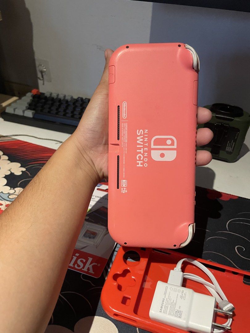 Nintendo switch lite coral (Category: Nintendo) located in Manila. Submitted by juszt (Listing ID 1446846228, Image 2). Description: Nintendo switch lite 4999 firm Inclusion: Check pics Sd card 128gb not sure if orig as is nalang Condition and issue: Scratches on screen glass replacement No other issues Pick up/ lalamove: north caloocan Meet up: qc/bulacan/south caloocan.