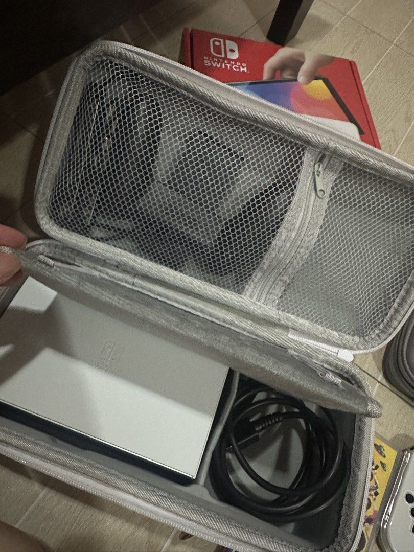 Nintendo Switch Oled (Category: Nintendo) located in Quezon City. Submitted by afnjes (Listing ID 1446791973, Image 3). Description: Inclusion Joycon Straps and Grip HDMI Cable Switch Dock Games : Everybody Switch (physical) Tiny Bookshop (Digital) Speedstorm (Digital) Pokemon Arceus (Digital) Moving Out 2 (Digital) Can also Trade to Steam Deck (willing to add reasonable price).