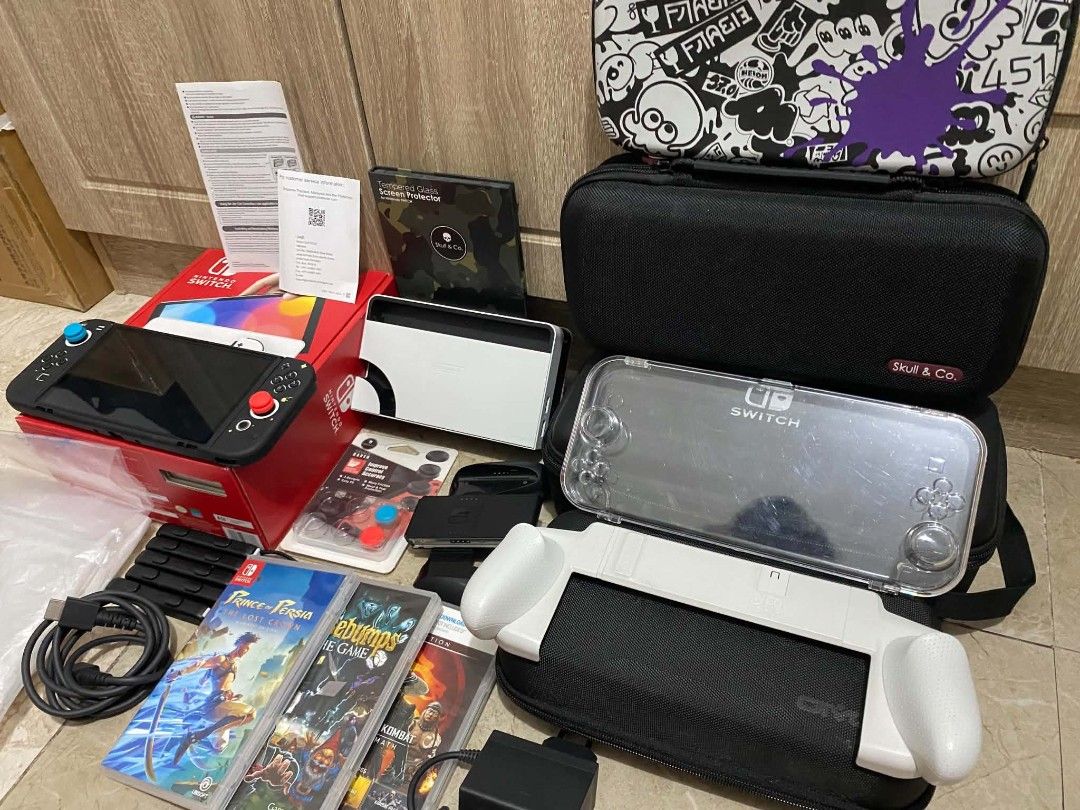 Nintendo Switch Oled Console with Games and Accessories (Category: Nintendo) located in Cavite. Submitted by hakue (Listing ID 1446783500, Image 1). Description: - Nintendo Switch Oled Console - Original Box Included - Dock and Controllers - Clear Protective Case - Carrying Bag - 3 Games - Great bundle for any gamer! all in message me para sa ibang pics .
